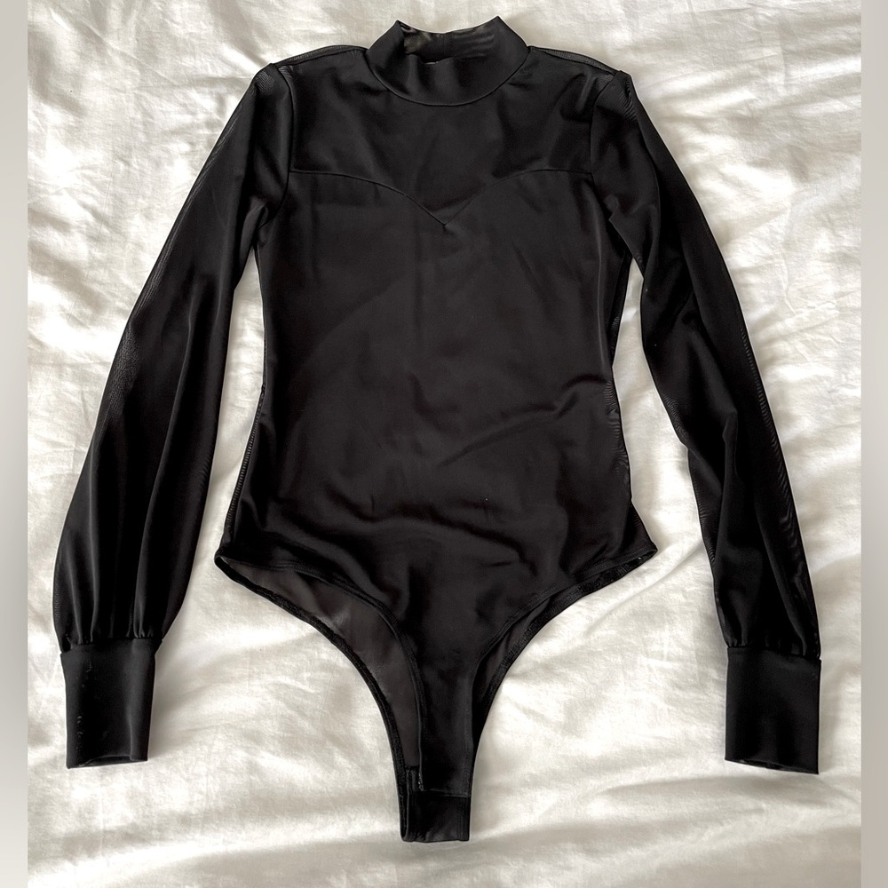 Black mesh body suit with princess top stitch.